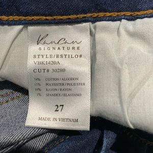 Distressed with patches of dark denim behind